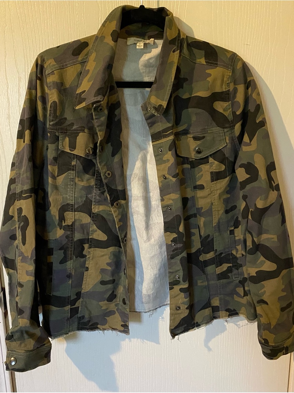 Umgee Camo Print Raw Hem Snap Front Trucker Jacket.